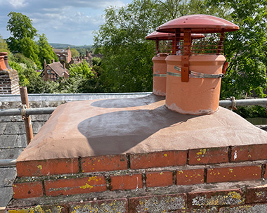 a chimney with a cowl guard installed on it 